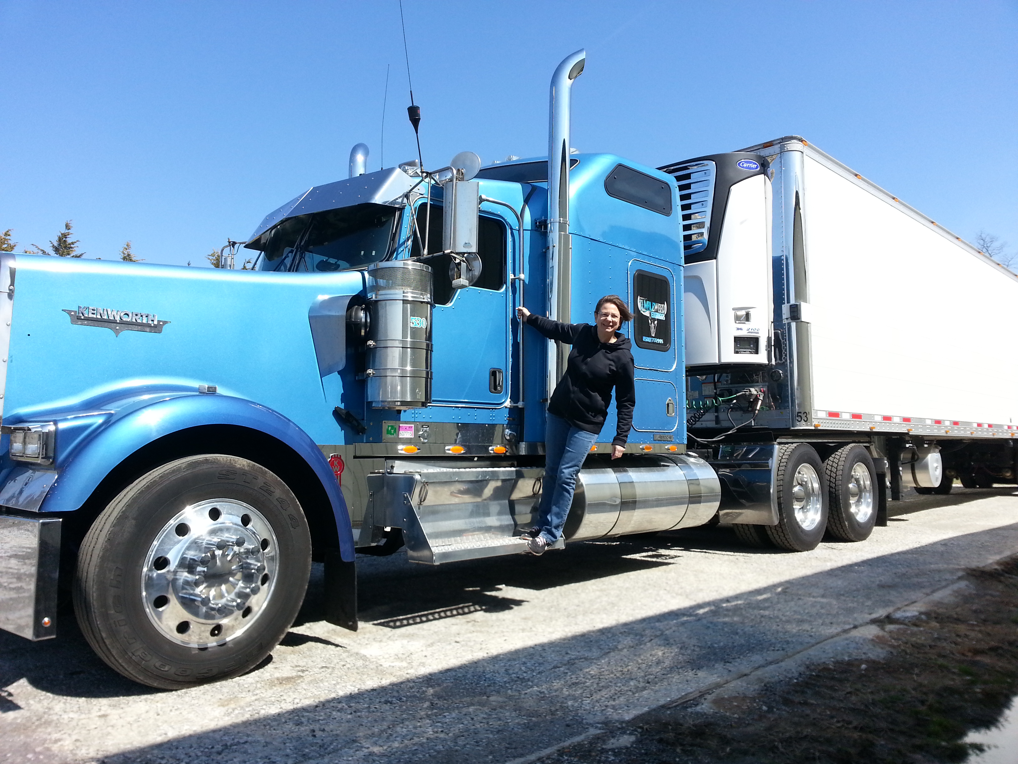 Big blue truck with Shelly on the step